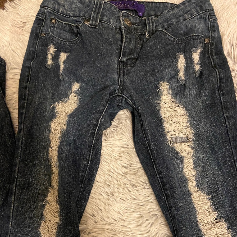 Miley Cyrus distressed jeans